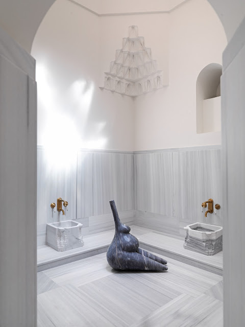 Elif Uras, Chamber of whispers, 2023, An
installation of three sculptures in Muğla marble Sitting Bather, 96 x 88 x 53
cm, exhibited as part of Healing Ruins at Zeyrek Çinili Hamam. Photograph,
Hadiye Cangökçe.
