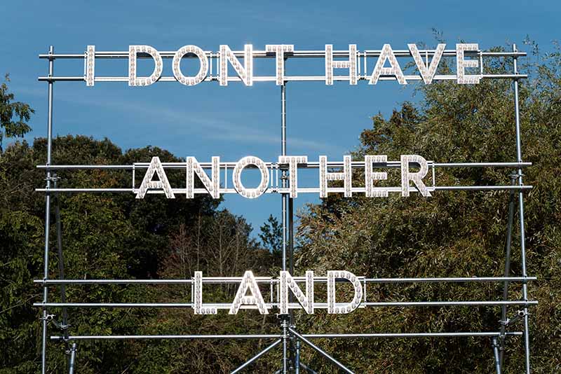 Nathan Coley, I Don't Have Another Land, 2022, The Page Gallery. Frieze Sculpture 2024. Photo by Linda Nylind. Courtesy of Linda Nylind/ Frieze.